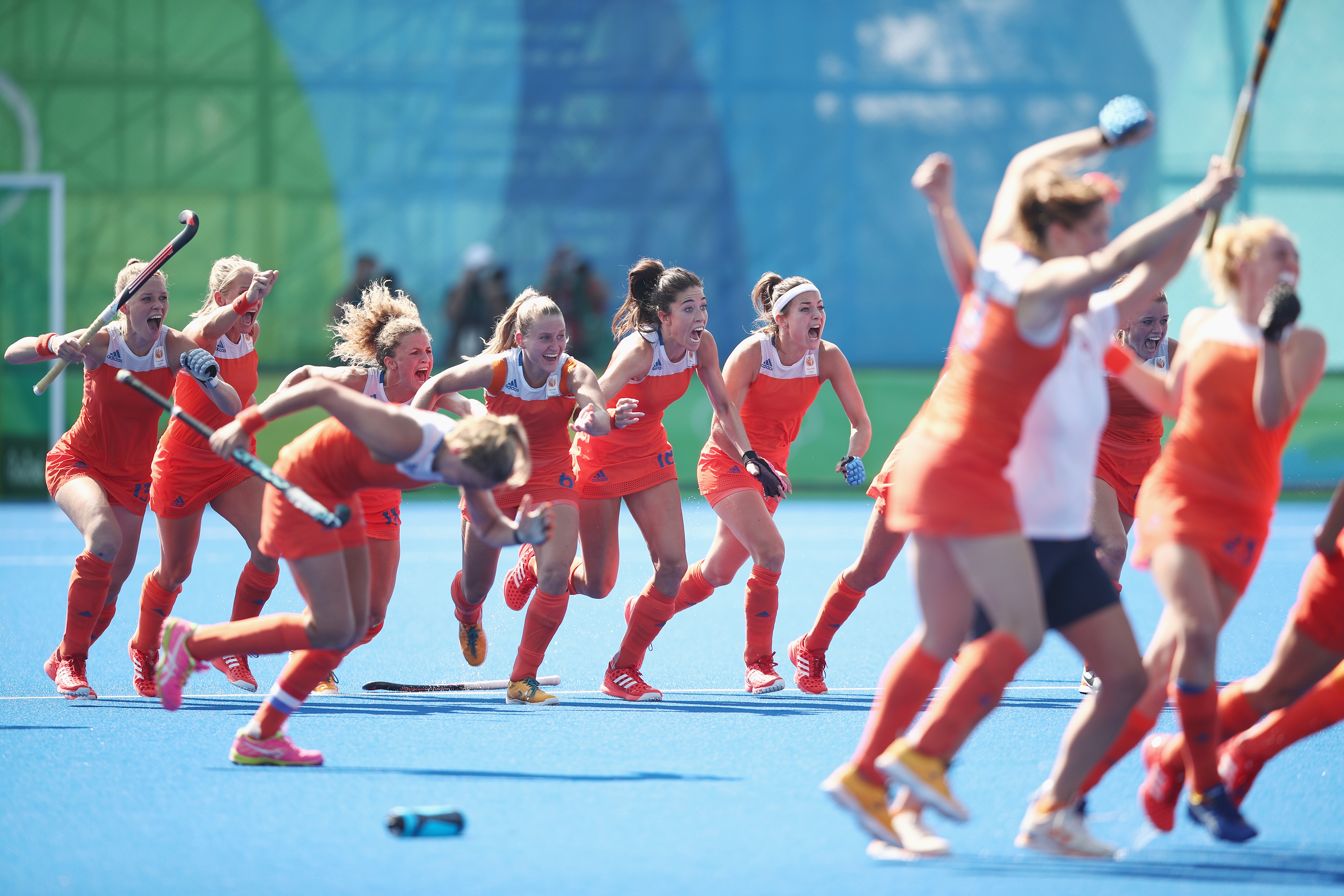 RIO DE JANEIRO, BRAZIL - AUGUST 17: The Netherlands celebrate victory in the penalty shootout during the womens semifinal match between the Netherlands and Germany on Day 12 of the Rio 2016 Olympic Games at the Olympic Hockey Centre on August 17, 2016 in Rio de Janeiro, Brazil. (Photo by Mark Kolbe/Getty Images)