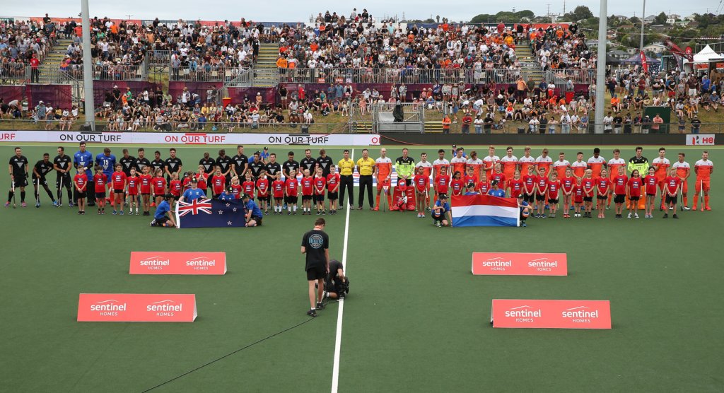 AUCKLAND, NEW ZEALAND - JANUARY 27: The teams sing the national anthems during the Men's FIH Field Hockey Pro League match between New Zealand and Netherlands at North Harbour Hockey Stadium on January 27, 2019 in Auckland, New Zealand. (Photo by Fiona Goodall/Getty Images)
