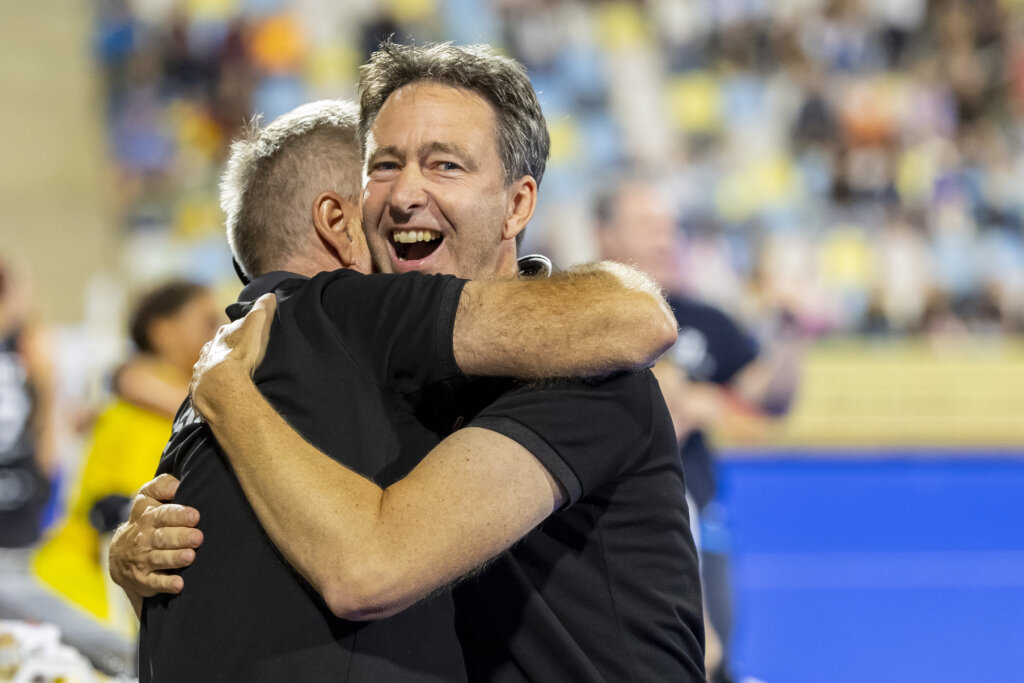 National coach Raoul Ehren embraces his assistant after reaching the European Championship final. Photo: William Vernes